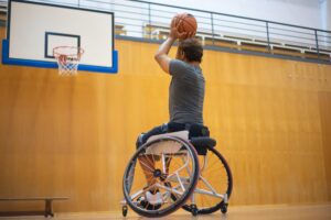 person in a wheelchair playing basketball