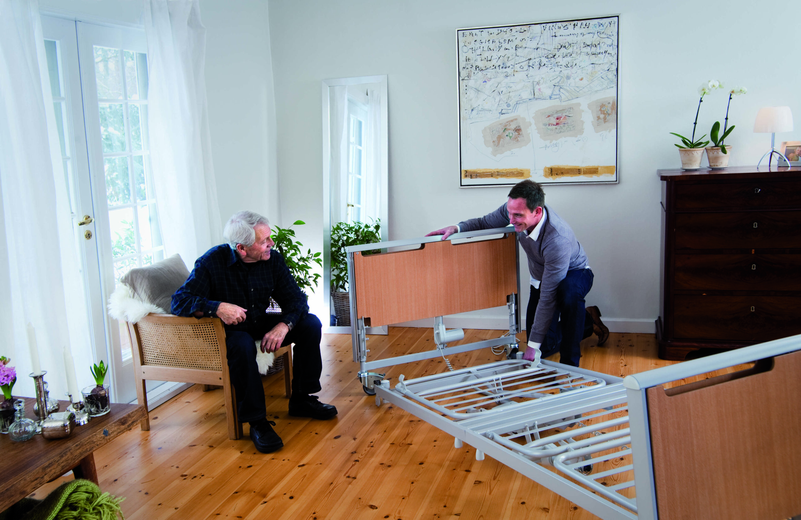 direct mobility professional setting up a hospital bed in a home